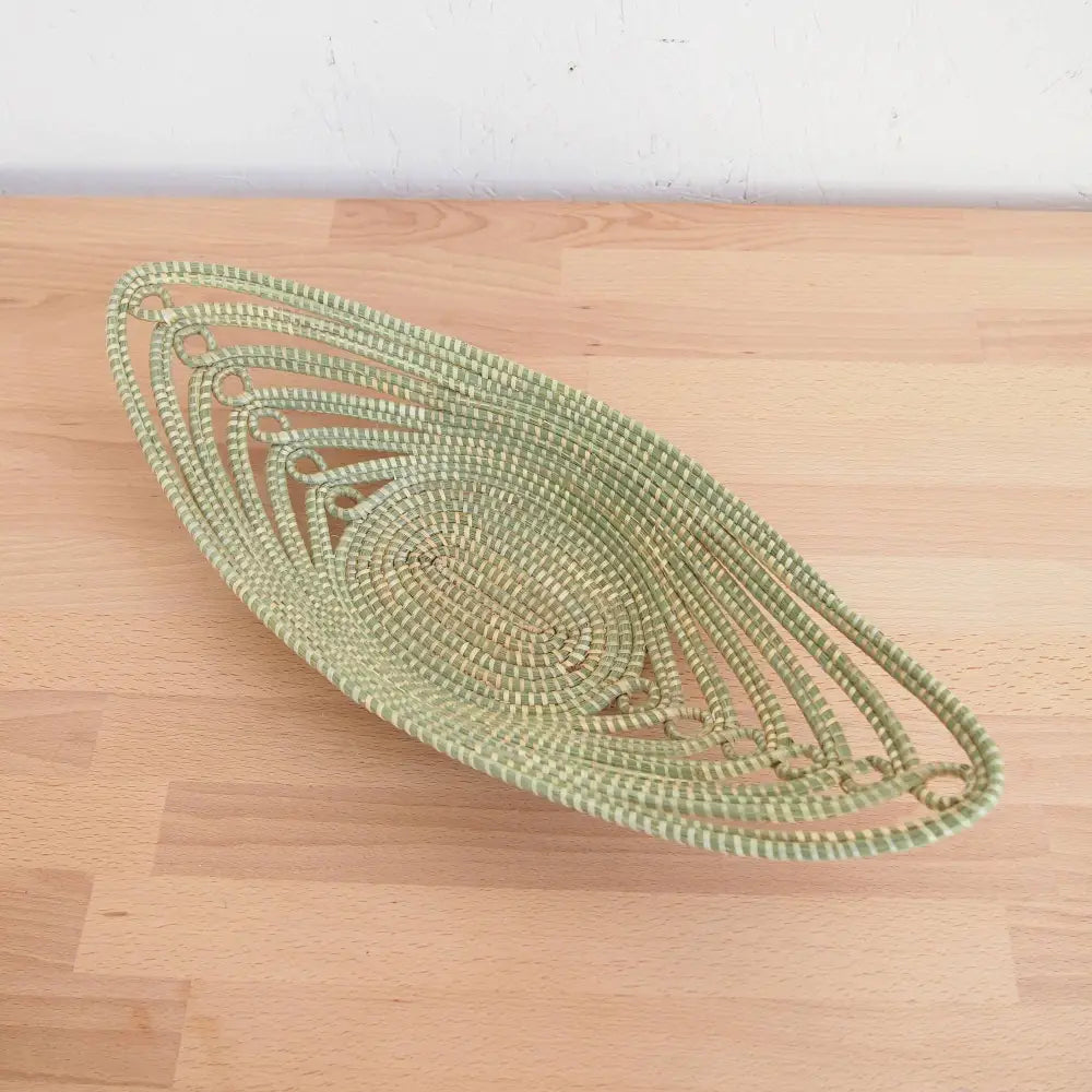 Green and beige woven grass sweetgrass African bread basket made with swamp grass