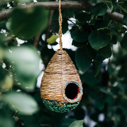 Handwoven teardrop sari birdhouse with recycled cotton trim and green patterns