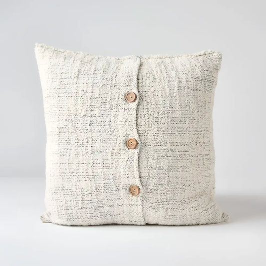 Off white and gray textured hand woven 20 inch x 20 inch pillow cover with three brown coconut buttons on one side 