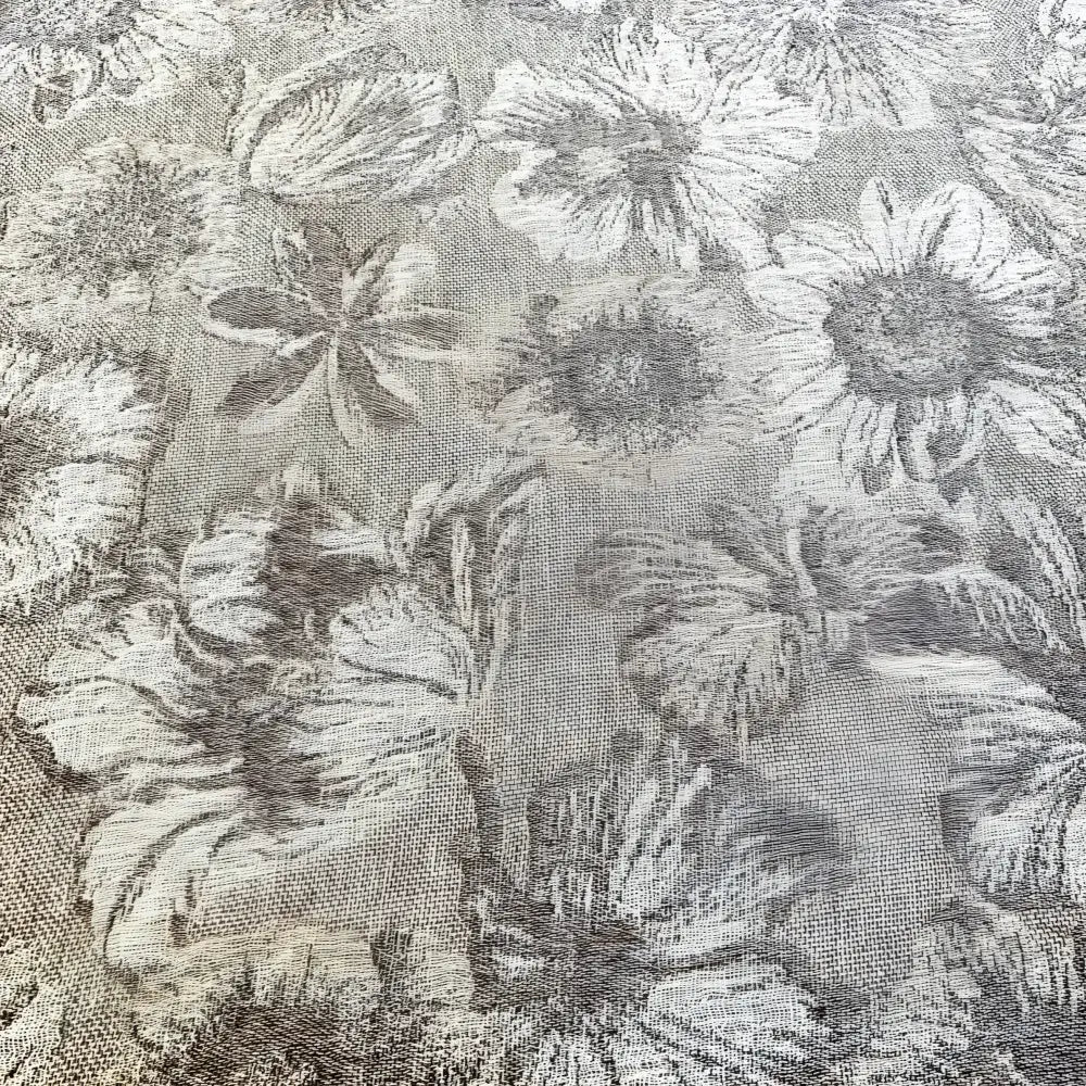 Textured linen bed runner with floral woven design in taupe and off white.