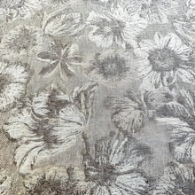 Textured linen bed runner with floral woven design in taupe and off white.