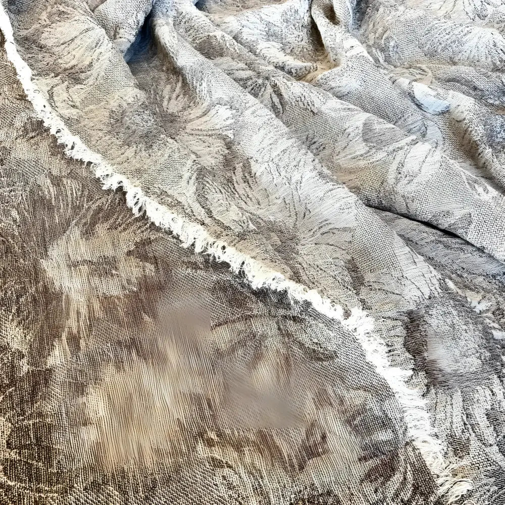 Textured linen bed runner with floral woven design in taupe and off white.