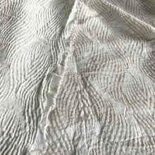 Oatmeal linen fabric with a swirl design