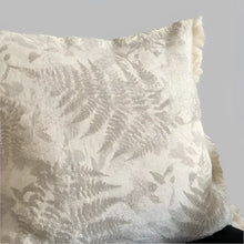 Pillow cover with woven fern designs in oatmeal color.