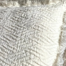 Linen pillow cover with a distinctive geometric textured weave in ivory.