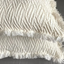 Linen pillow cover with a distinctive geometric textured weave in ivory.