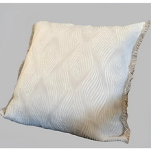 Linen pillow with swirl woven design.