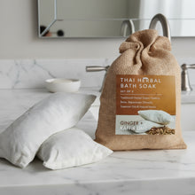 Burlap bag of Thai herbal bath soak with herbal sachets for smooth skin