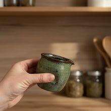 Handcrafted Thumb Divot 8 oz ceramic pitcher with mottled green glaze