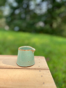 Handmade light green ceramic tiny pitcher for syrup or cream