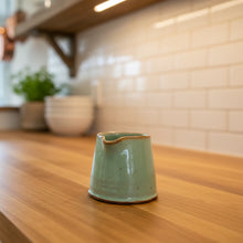 Handmade light green ceramic tiny pitcher for syrup or cream