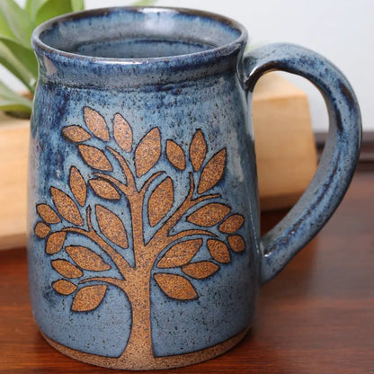 Gorgeous hand thrown Blue ceramic tree mug from Handmade Pottery for cozy sips