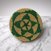 Handmade handwoven african basket with green and gold starburst pattern and hanging loop in small sisal bowl size