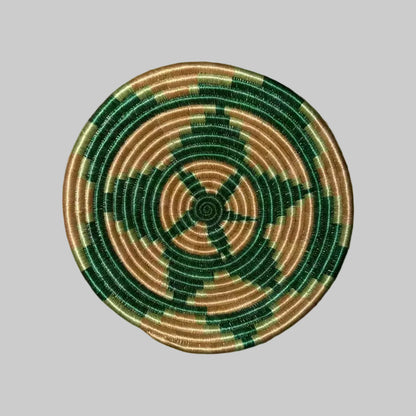 Handmade triangular small sisal bowl with hanging loop featuring deep green tan concentric rings and central starburst pattern