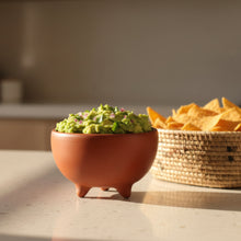 Handmade barro rojo tripod bowl from Oaxaca, brimming with green coffee beans