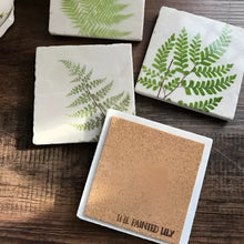 Square tumbled marble tile coasters with vintage fern designs and fully backed stone coasters