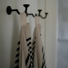 Melika Turkish cotton striped towel on black metal rack for spa-like experience