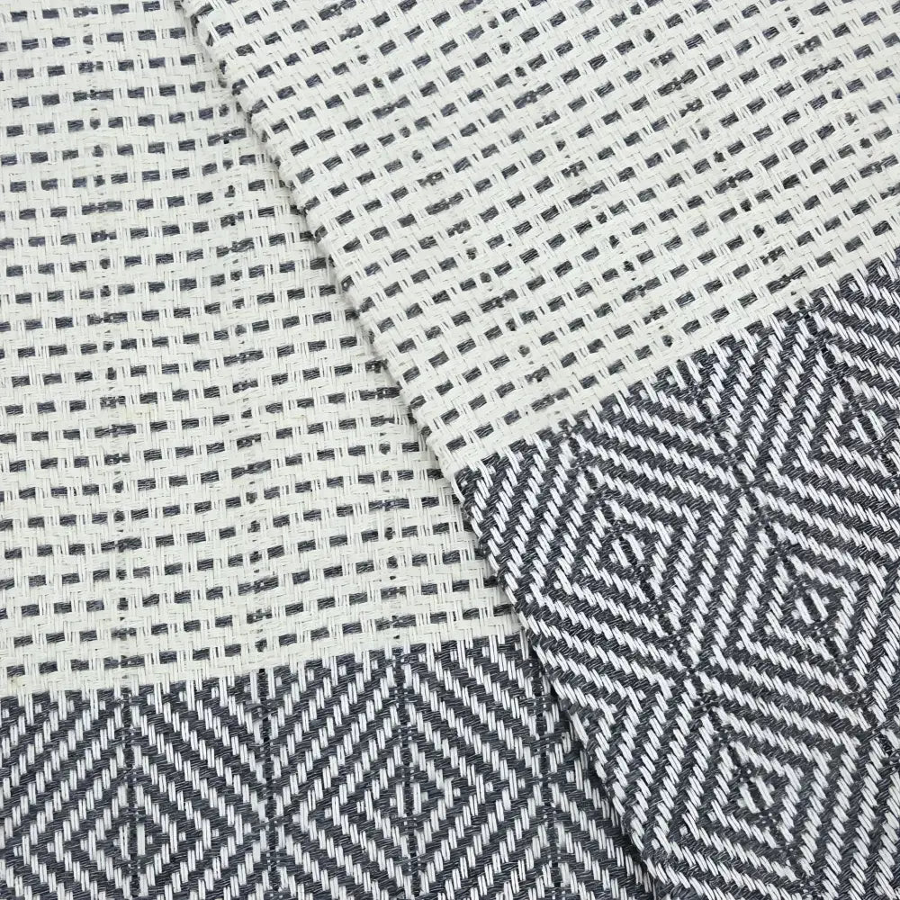 Turkish hand towel with diamond and dot woven design in gray.