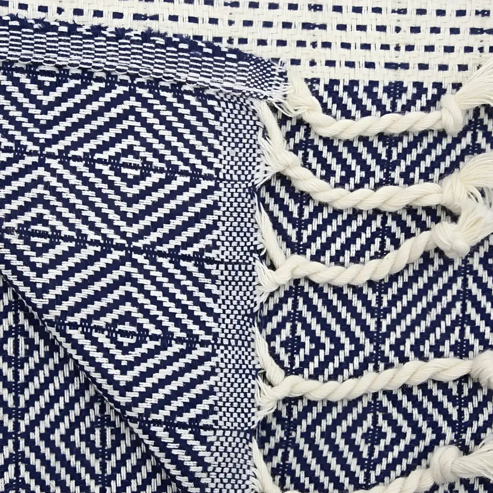 Turkish hand towel with diamond and dotted woven designs in navy blue.