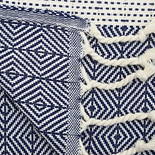 Turkish hand towel with diamond and dotted woven designs in navy blue.