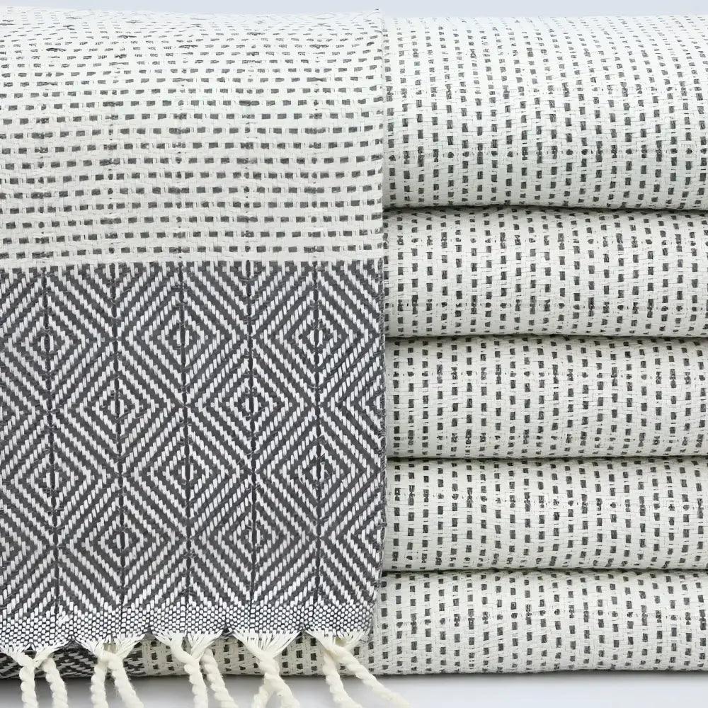 Turkish hand towel with diamond and dot woven design in gray.