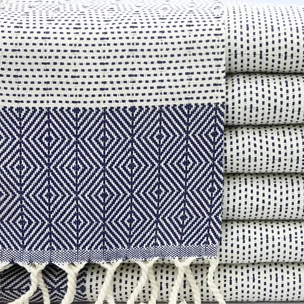 Turkish hand towel with diamond and dotted woven designs in navy blue.