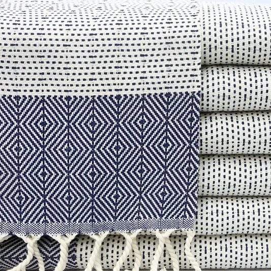 Turkish hand towel with diamond and dotted woven designs in navy blue.