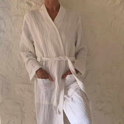 Person wearing a white muslin bathrobe