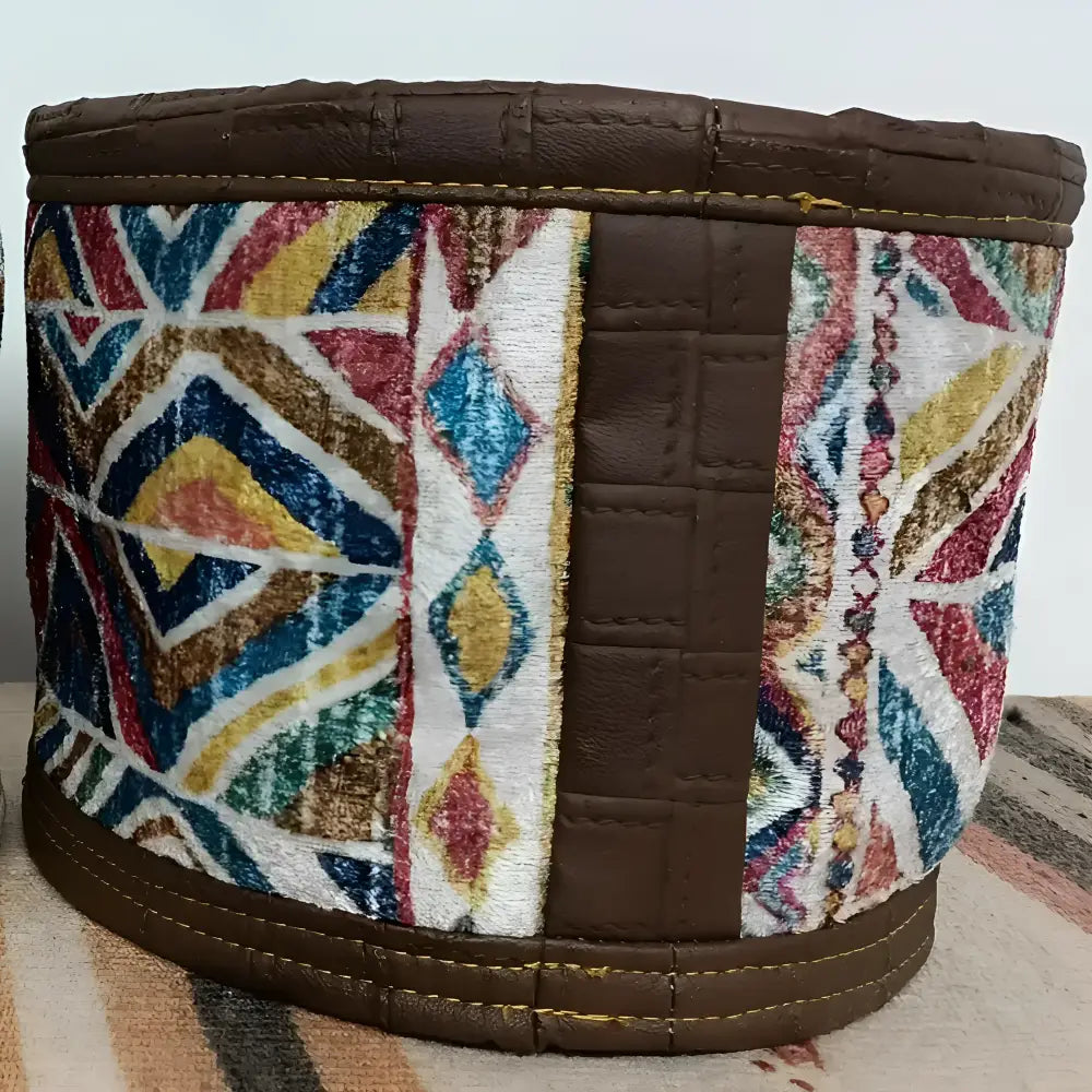 Soft basket created from Turkish rug remnants in colorful geometric design.