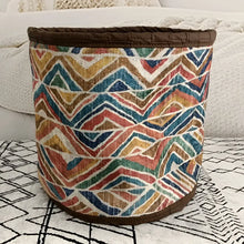 Soft basket created from Turkish rug remnants in colorful geometric design.