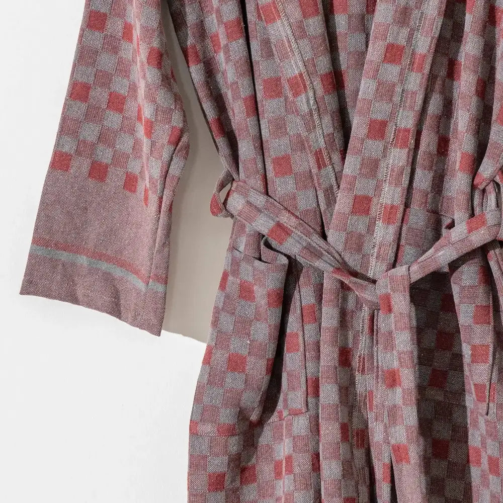 100% cotton robe with a flat woven Turkish towel texture and a hood in a checkered brick color.