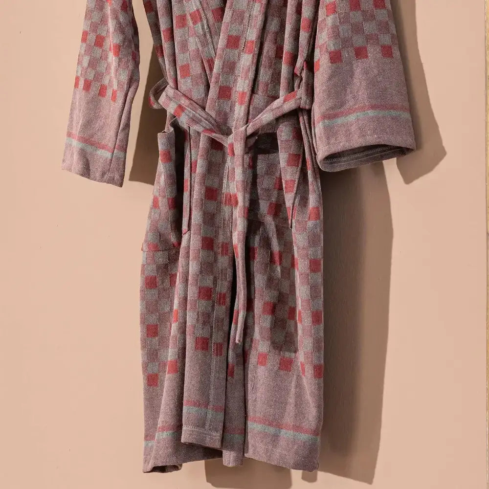 100% cotton robe with a flat woven Turkish towel texture and a hood in a checkered brick color.