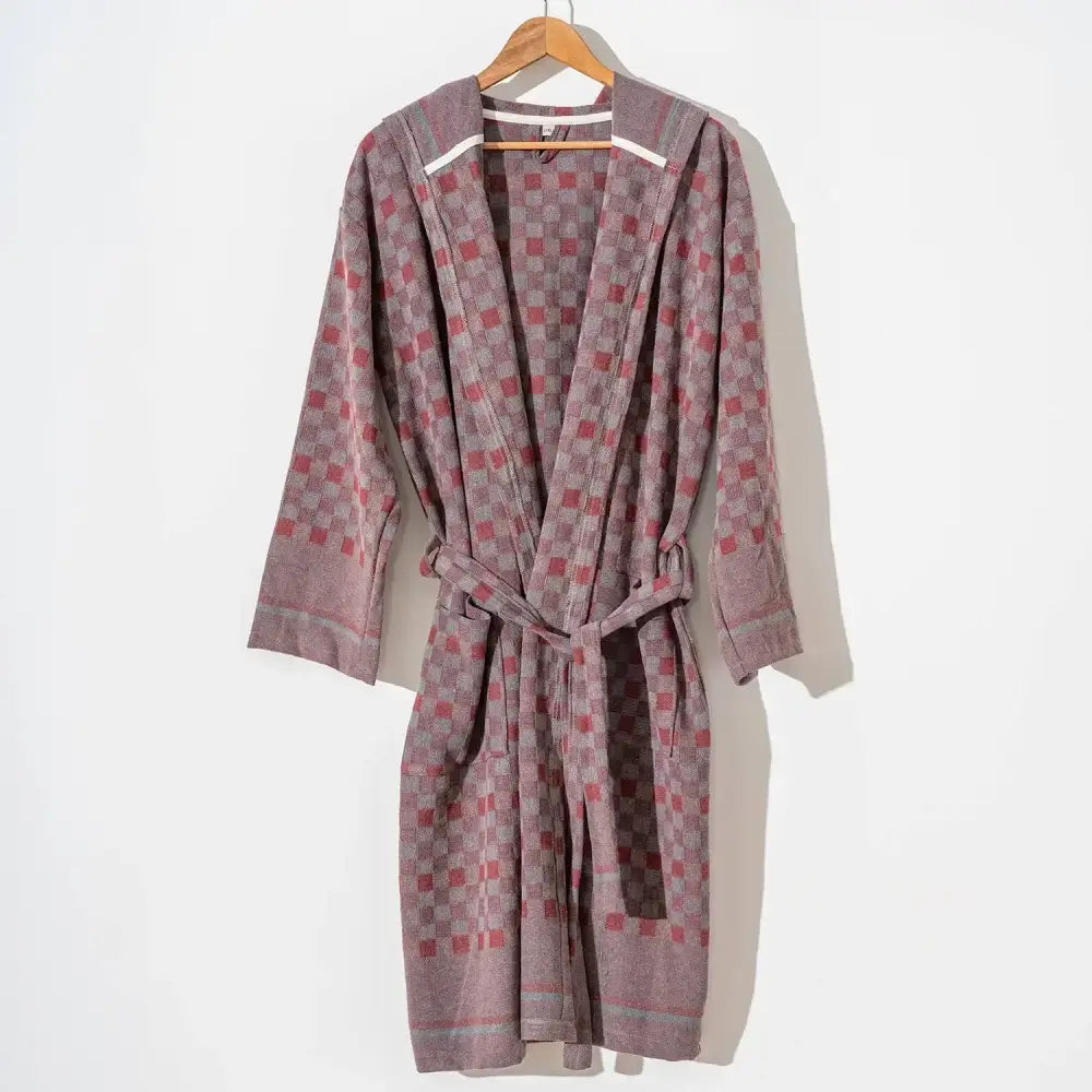 100% cotton robe with a flat woven Turkish towel texture and a hood in a checkered brick color.