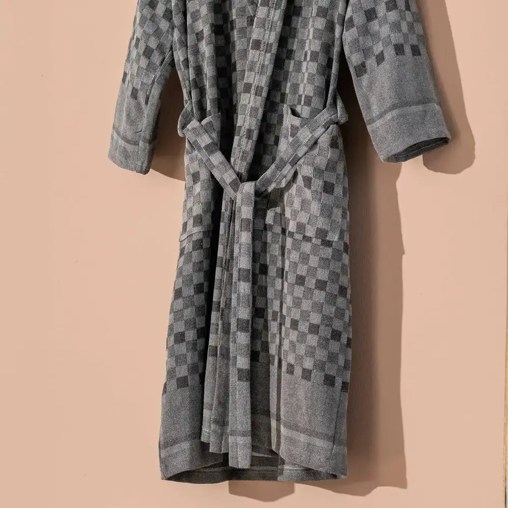 100% cotton robe with a flat woven Turkish towel texture and a hood in a checkered black and gray color.