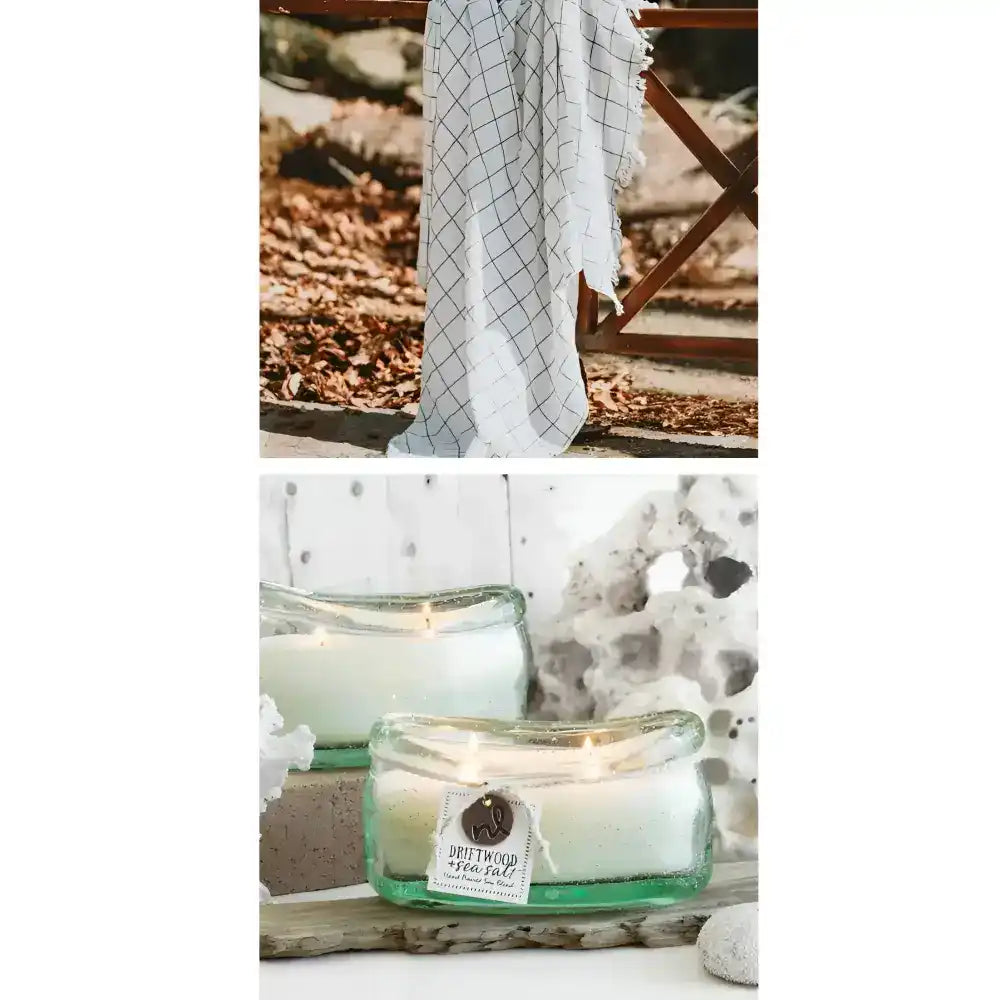 Candle in a glass jar with a label, set against a natural background.