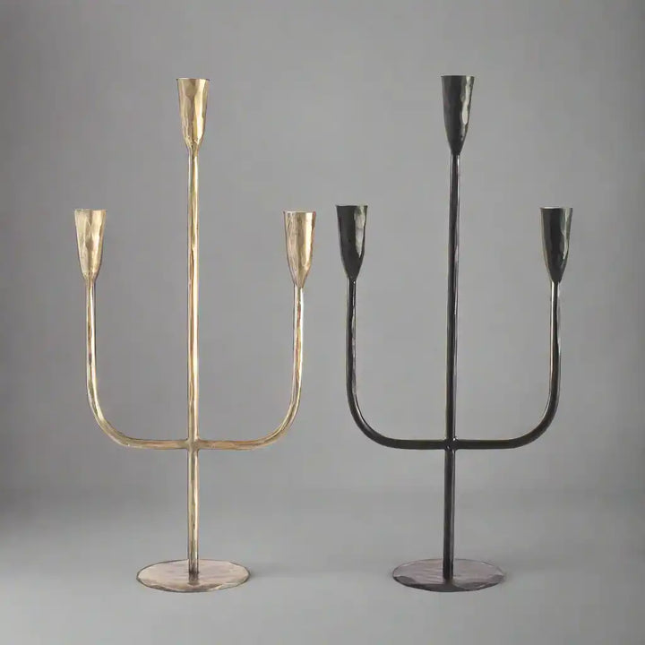 Hand Forged Iron Candelabra in brass and black on light background