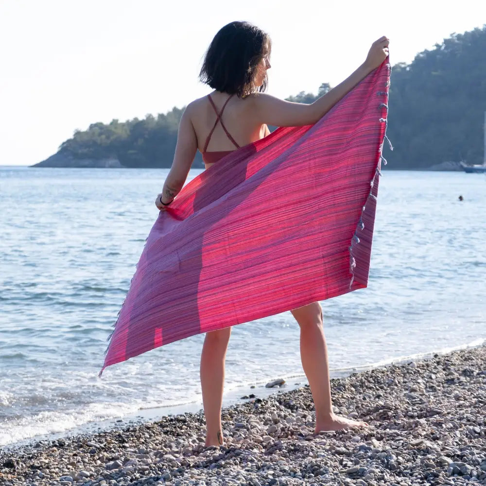Striped multicolor Turkish beach towels with tassel fringe.