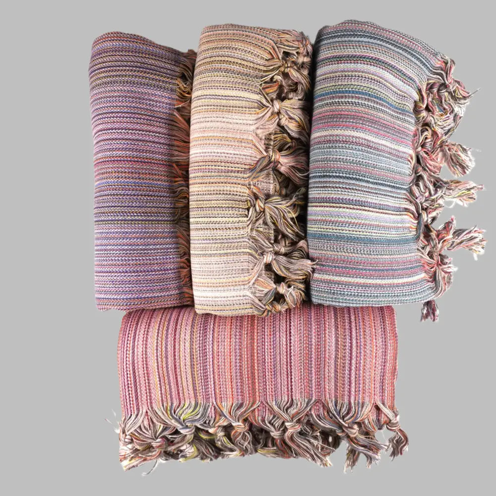 Striped multicolor turkish beach towels with tassel fringe.