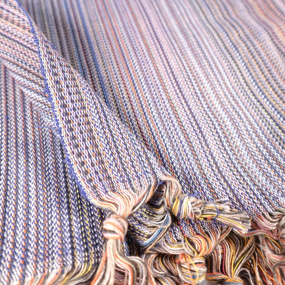 Striped multicolor Turkish beach towels with tassel fringe.