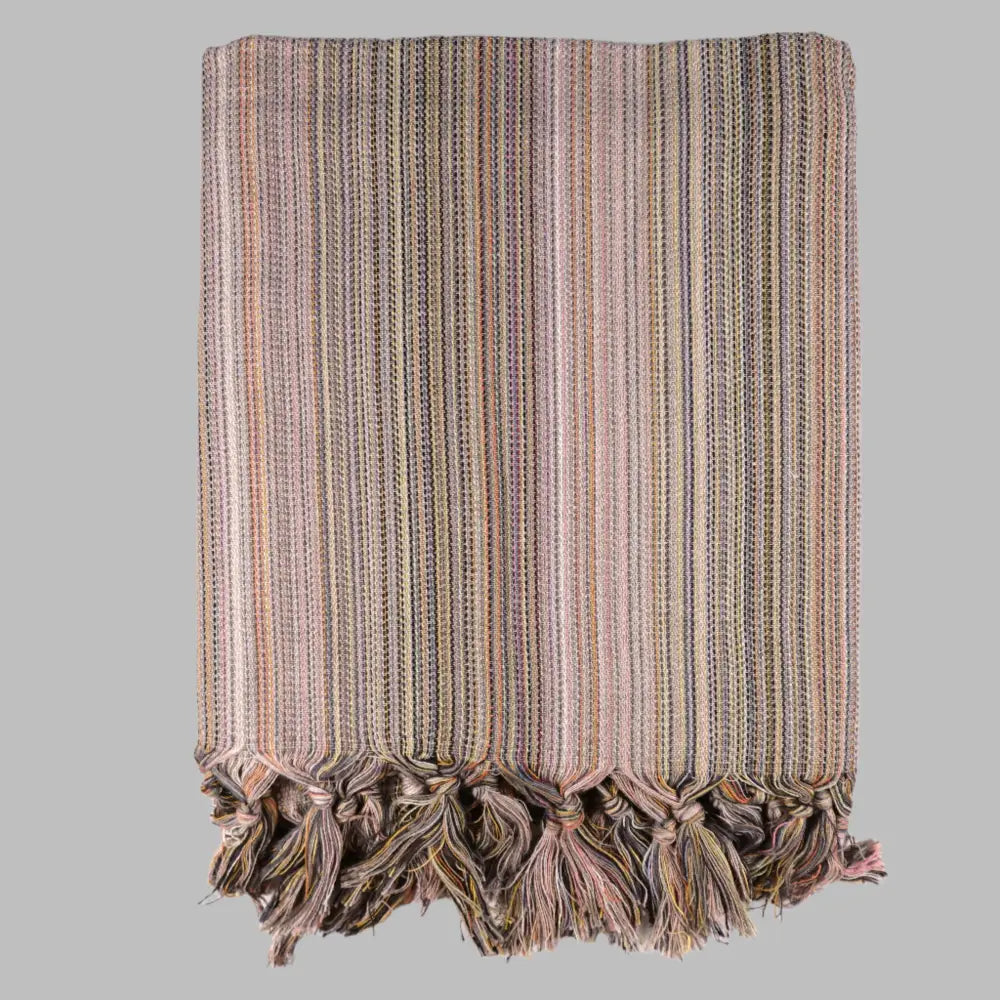 Striped multicolor Turkish beach towels with tassel fringe.