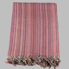 Striped multicolor Turkish beach towels with tassel fringe.