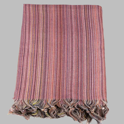 Striped multicolor Turkish beach towels with tassel fringe.