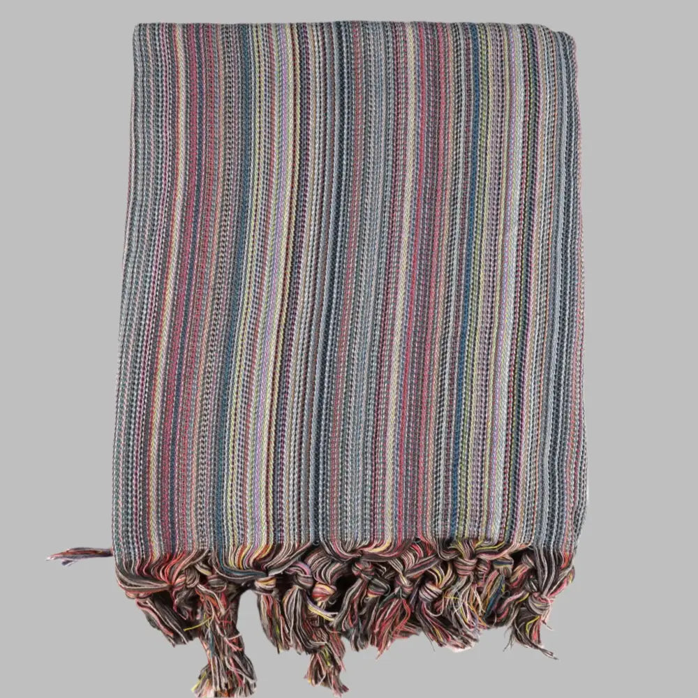 Striped multicolor Turkish beach towels with tassel fringe.