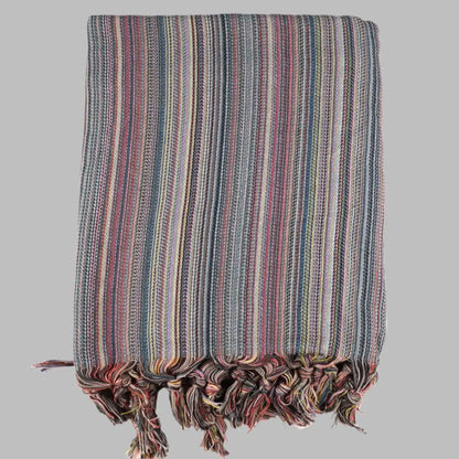 Striped multicolor Turkish beach towels with tassel fringe.
