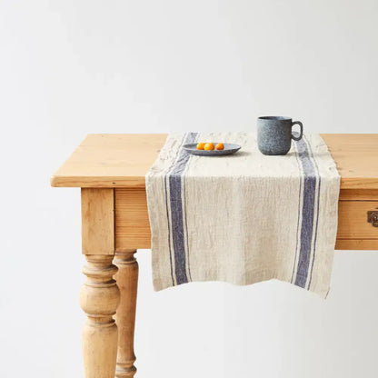 Vintage linen table runner with indigo stripes and rustic charm, fringed ends
