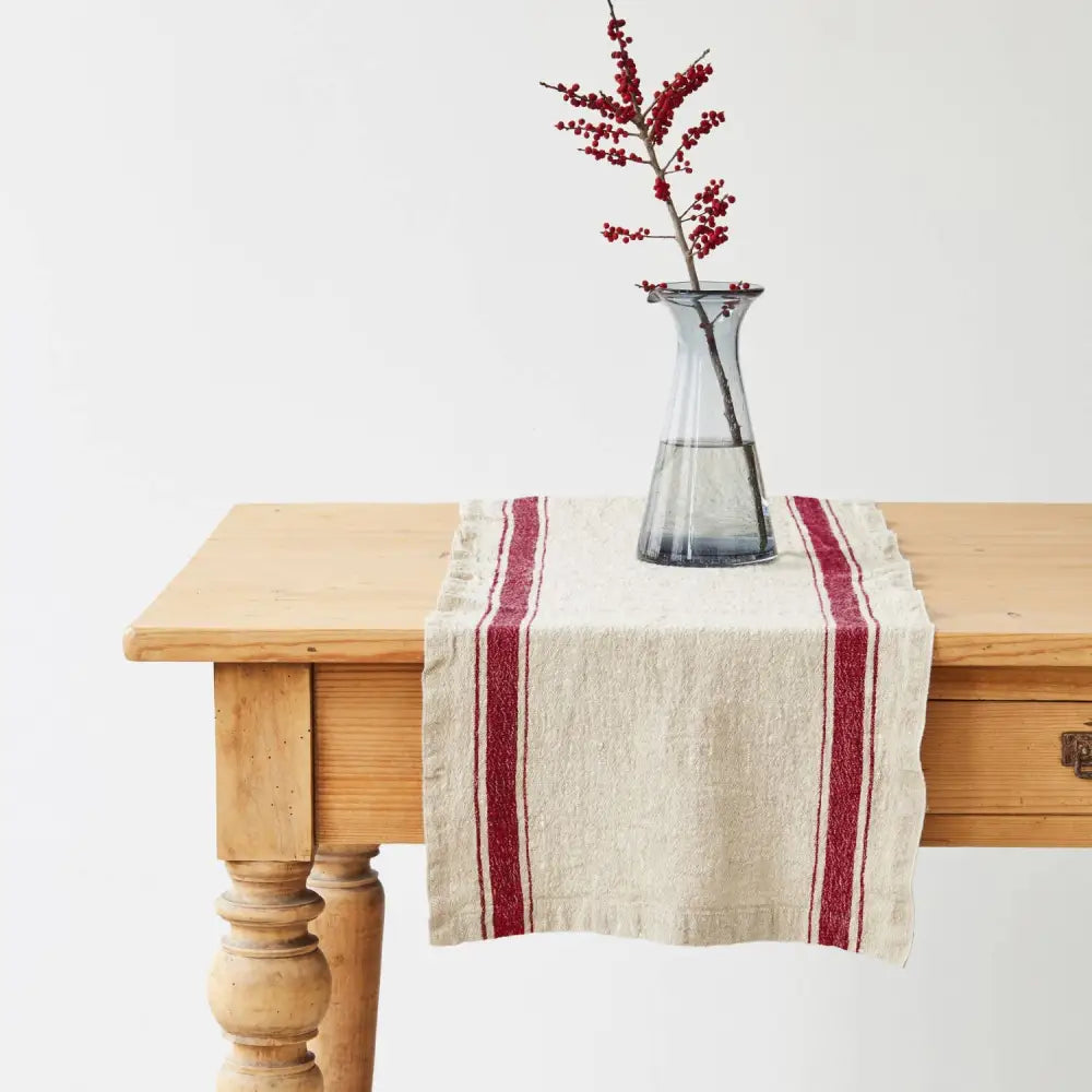 Vintage linen table runner with red stripes adds rustic charm to your table decor