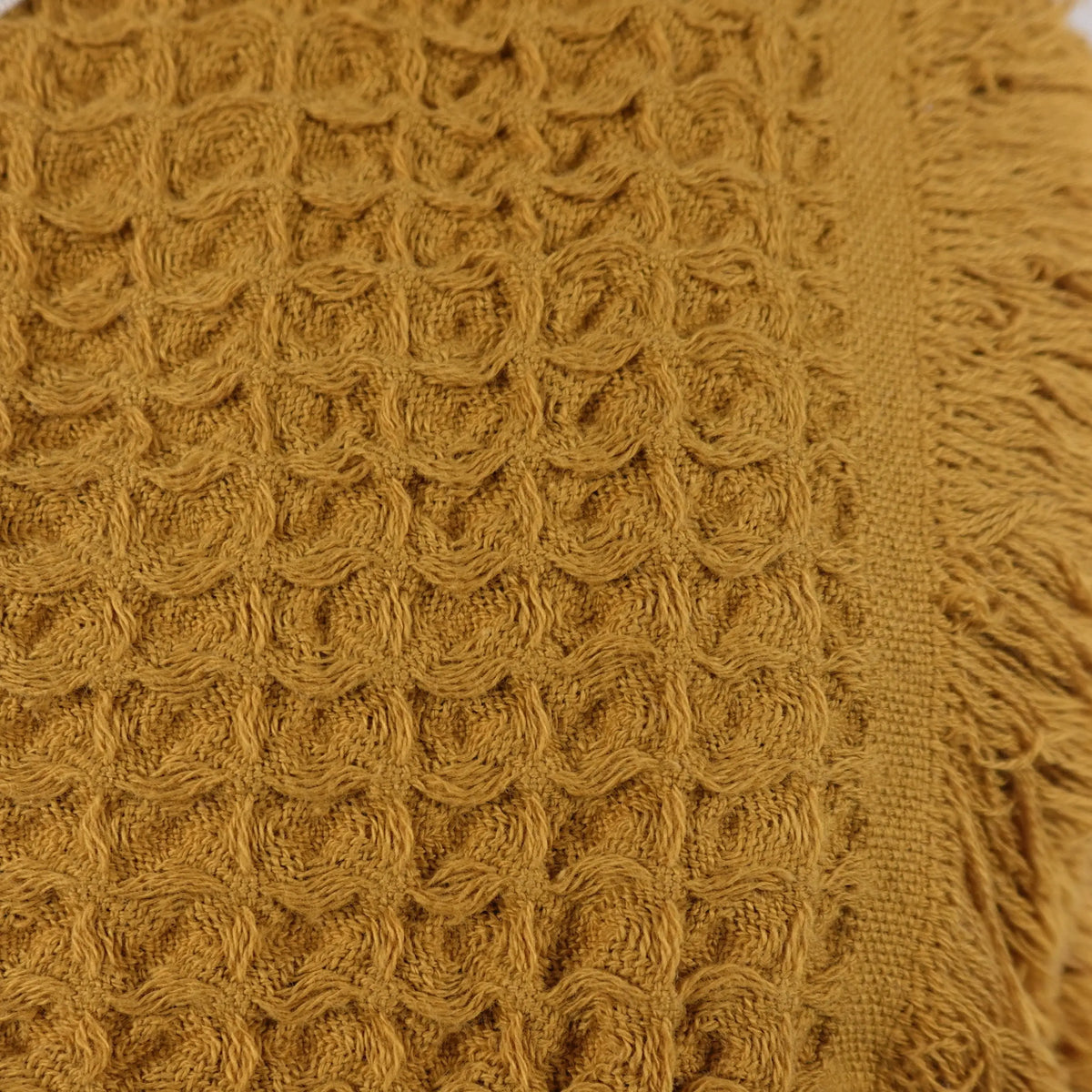 Textured mustard yellow waffle bath towel with fringe made from pure Aegean cotton