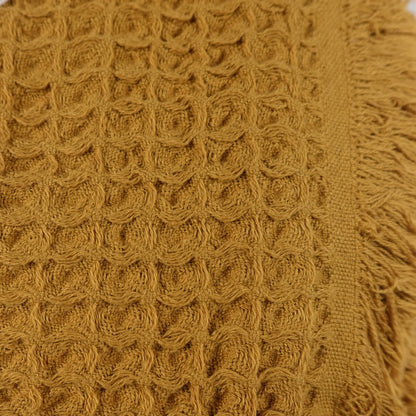Textured mustard yellow waffle bath towel with fringe made from pure Aegean cotton