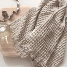 Waffle weave Turkish hand towel with exceptionally soft fibers.