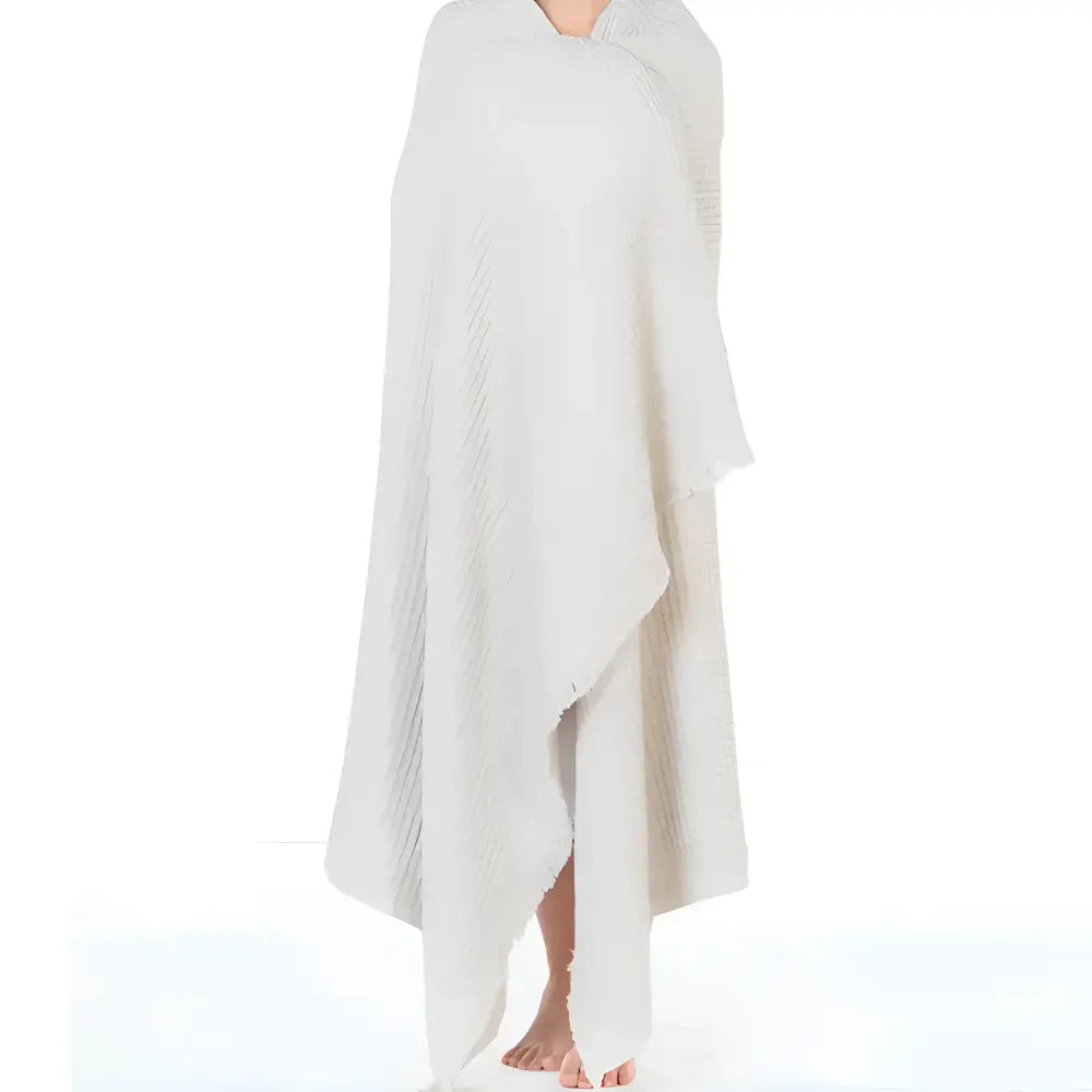 Sand colored waffle textured soft throw blanket.